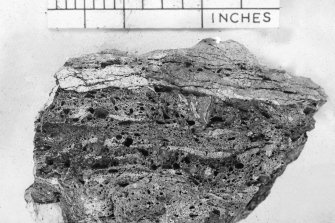 Copy of black and white slide showing detail of vitrification, Dun MacUisneachan, Strathclyde
vitrification showing disruption of schist along foliation planes
NMRS Survey of Private Collection 
Digital Image Only