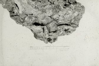 Copy of black and white slide showing detail of vitrification Dun Deardail, Glen Nevis, Highland. " Vitrification containing wood casts showing cross section of a log."
NMRS Survey of Private Collection 
Digital Image Only