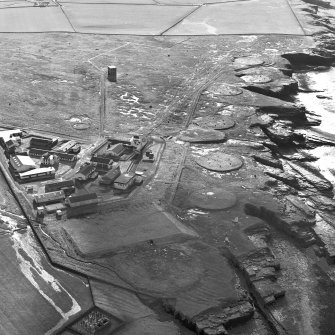 Oblique aerial view of Forss centred on the remains of a radio station, taken from the NE.