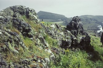 Copy of colour slide showing view of vitrified mass of rampart, Dunagoil, Bute
NMRS Survey of Private Collection 
Digital Image Only