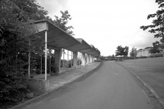General view of South-East covered walk from South-East, showing cantilevered concrete construction.
Digital image of B 55469.