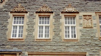 Detailed view of windows and stonework.