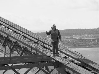 Mr Alex White, Forth Bridge Inspector, on the North cantilever of the Fife erection.
