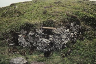 Copy of colour slide showing detail of Tap o' Noth, Grampian  insc: "inner side of vitrified mass,S.W. flank just opposite the well. Shows at least four transverse beam holes"
NMRS Survey of Private Collection
Digital Image only