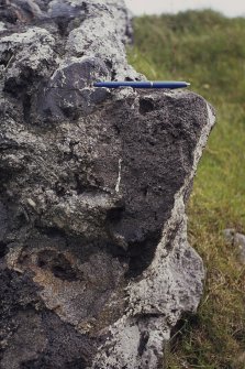 Copy of colour slide showing possible vitrification near Dunnideer.
Insc: " Detail of vitrification at N.E. corner, outer side - break up of ?granite block and small wood casts in apparently solid boulders"
NMRS Survey of Private Collection
Digital Image only