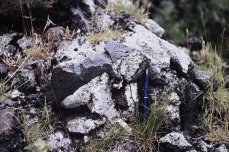 Copy of colour slide showing possible vitrification near Dunnideer.
Insc: " Detail of vitrified mass on south side - detail of contact between homblendic and granitic rocks"
NMRS Survey of Private Collection
Digital Image only
