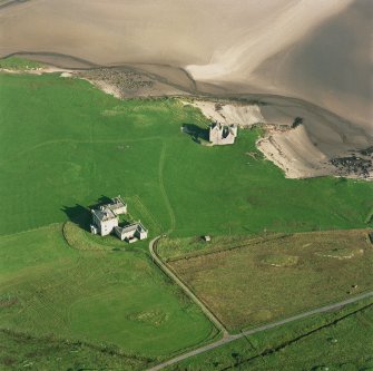 Oblique aerial view of Breachacha centred on Breachacha House and a castle, taken from the W.
