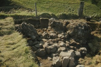 Copy of colour slide showing detail of excavations at Cullykhan, Castle Point, Troup, Banffshire - prehistoric hut?
NMRS Survey of Private Collection
Digital Image only