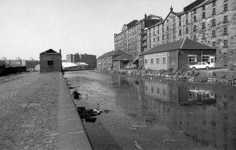 View from SSW showing part of W front of City of Glasgow Grain Mills with Sugar Refinery in background