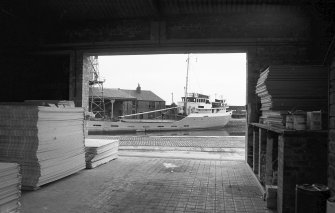 Interior
View of warehouse looking ENE showing part of boat in harbour with part of grain wharf warehouses in background