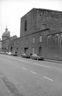 View from ESE showing part of S front (Baltic Street front) of gasworks with corn exchange in background