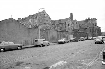 View from E showing NNE front of number 6 with warehouses on left