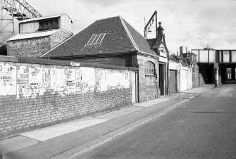 View from N showing WNW front and part of N front of booking office
