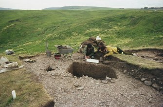 Copy of colour slide showing view of excavations at Cullykhan, Castle Point, Troup, Banffshire -stake holes and trench?
NMRS Survey of Private Collection
Digital Image only