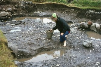 Copy of colour slide showing detail of excavations  Cullykhan, Castle Point, Troup, Banffshire
-digging in the mud!
NMRS Survey of Private Collection
Digital Image only