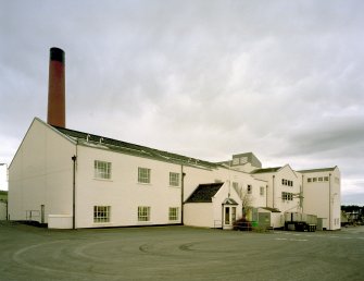 Benrinnes Distillery
Exterior view from east of main production block of distillery, comprising (left to right) boilerhouse chimney (behind), Still House (item 7 on plan), and Mash House, Draff outlet and Malt Bins (far right).
Digital image of D 39104 CN.