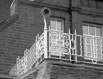 Detail of ornate ironwork on roof of distillery offices.
Digital image of B 74136.