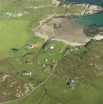 Oblique aerial view of Sorisdale centred on cottages, taken from the W.