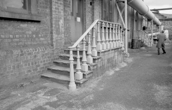 View showing cast iron railing of exhauster house