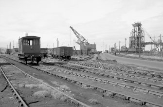 View from ENE showing harbour office with coal drop on right and trucks on left