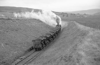 View looking E from Minnivey showing NCB locomotive number 21 and wagons with mine in background