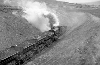 View looking E from Minnivey showing NCB locomotive number 21 and wagons with mine in background