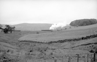 Distant view showing NCB locomotive number 21 and wagons at Minnivey