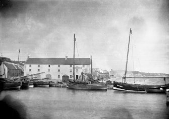 General view of harbour with Crusoe Hotel in the background
