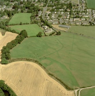 Dalginross, oblique aerial view, centred on the cropmarks of the Roman Temporary Camp and Fort. Digital image of C/52992/CN.