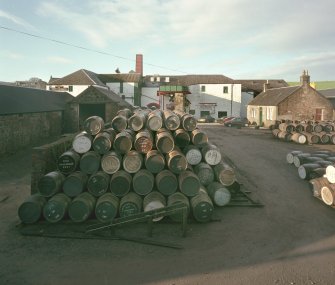 Elevated view from NE of main production block of distillery, including Still House, Mash House, Mill House and Tun Room, with yard (full of casks) in foreground, and Office (right))
Digital image of C 64600 CN