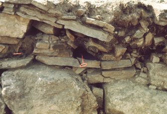 Copy of colour slide showing detail of excavation at Tor A'Chorcain, Langwell - OUTER WALL FACE
JK-9 Timber slots in outer face of wall
NMRS Survey of Private Collection
Digital Image only