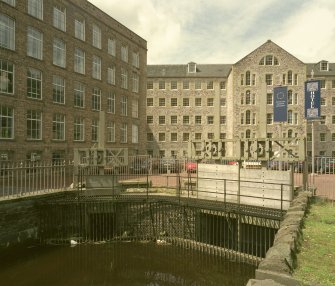 View from E of lade and sluices in front of Mill No. 2 (left) and Mill No. 1 (right)