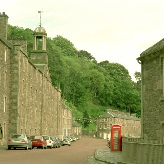 Oblique view from W of New Lanark Road, with New Buildings in foreground (left), telephone box (right), and the Counting House (Caithness Row) in background