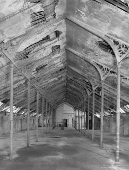 Interior.
View of top flat of mill from East showing ornate perpendicular gothic cast iron roof trusses.