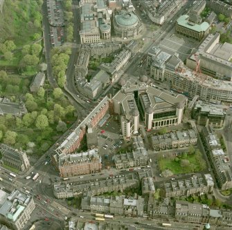 Oblique aerial view of Edinburgh centred on the Caledonian Hotel and Standard Life building, with Rutland Square adjacent, taken from the NW.