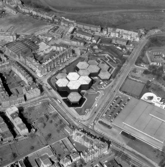 Aerial view including Dalkeith Road, Scottish Widows' Fund and Life Assurance Society, Holyrood Park Road, Preston Street Primary School, the Royal Commonwealth Pool and Newington Burial Ground seen from the South. Digital image of B/21810.