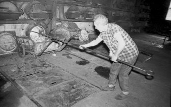 Interior 
View of retort house showing man working