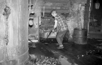 Interior 
View of retort house showing man working