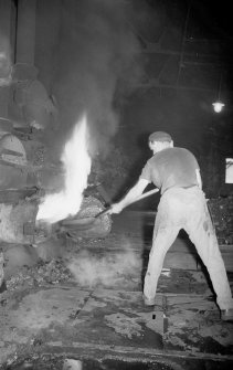 Interior 
View of retort house showing man working