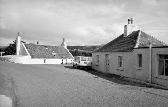 View from WNW showing two single storey cottages