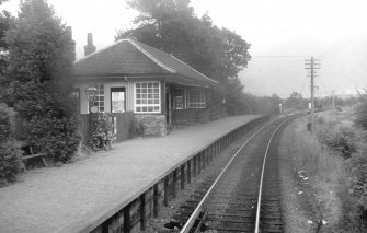 View from WNW showing wood and brick platform shelter with glazed screens