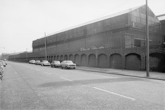 View from NW showing arched wall on Shettleston Road and forge building