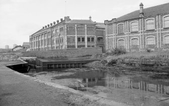 View from S showing WSW and part of SSE fronts of N Ruchill street building and part of WSW front of S Ruchill street building