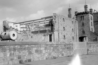 View from W showing W bay wing under demolition