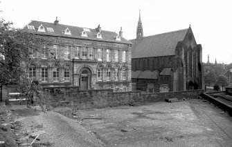 View from WSW showing SSW front of school and SSW and part of WNW fronts of church
