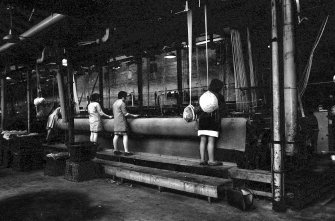 Interior
View showing women working on 27' setting loom