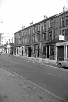 View from SSW showing W front of warehouse with part of no 24 Oswald Street in foreground