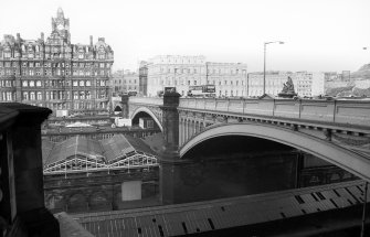 View from SSE showing WSW front of North Bridge, with part of W end of Waverly Station in foreground, North British Hotel in left background and GPO building in right background