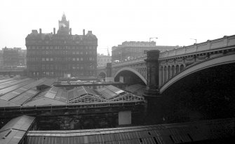 View from SSE showing WSW front of North Bridge, with part of W end of Waverly Station in foreground and North British Hotel in background