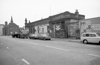 View from NW showing WNW and NNE fronts of NE station block which has been converted to public house and depot